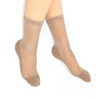 gold socks worn on a white background