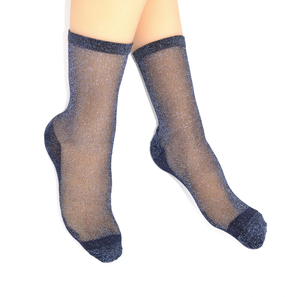 Pair of Tiffany Midnight sheer sparkle socks worn on feet, showing the sheer glitter finish and darker toe and heel.