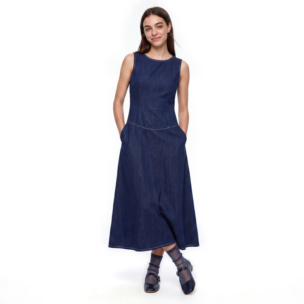 Model wearing Tiffany Midnight sheer sparkle socks with a navy midi dress and navy shoes.