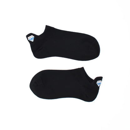 A pair of black no show socks with diamond-shaped embroidered tabs at the heel.