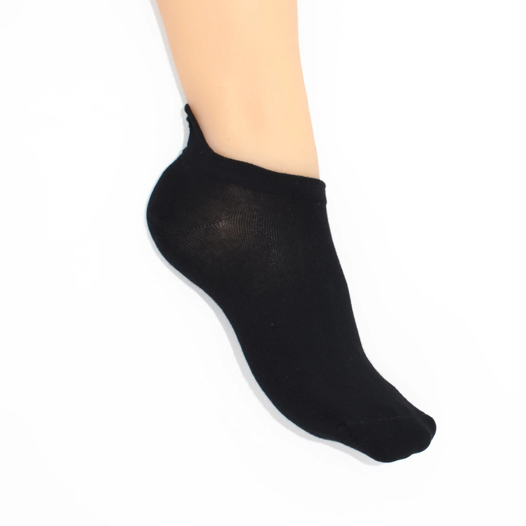 A leg modelling black no show socks with diamond-shaped embroidered tabs at the heel.