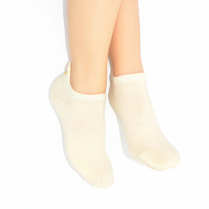 legs showing a soft yellow no show sock with chicken embroidered motif design