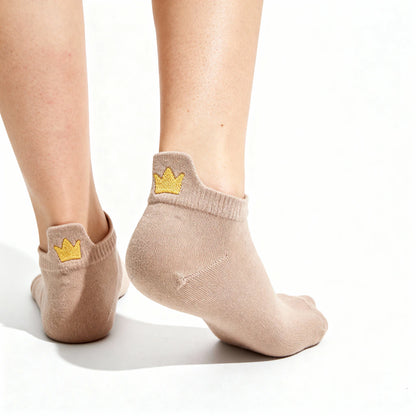 Beige ankle socks with gold crowns on a white background