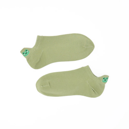 A pair of sage green no-show socks with an embroidered frog heel tab.