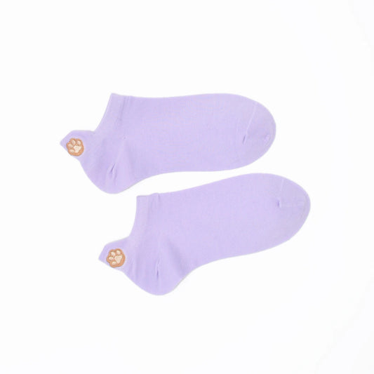 A pair of purple no-show socks with an embroidered paw print tab on the heel.