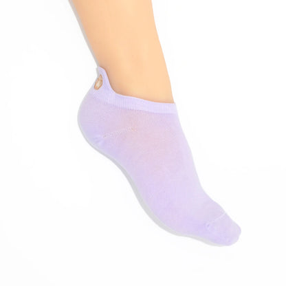 A leg modelling purple no-show socks with an embroidered paw print tab on the heel.
