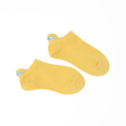 A pair of yellow no-show socks with an embroidered fish heel tab.