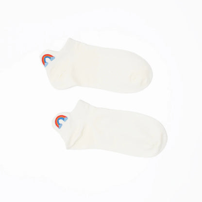 A pair of white no-show socks with an embroidered tab at the heel