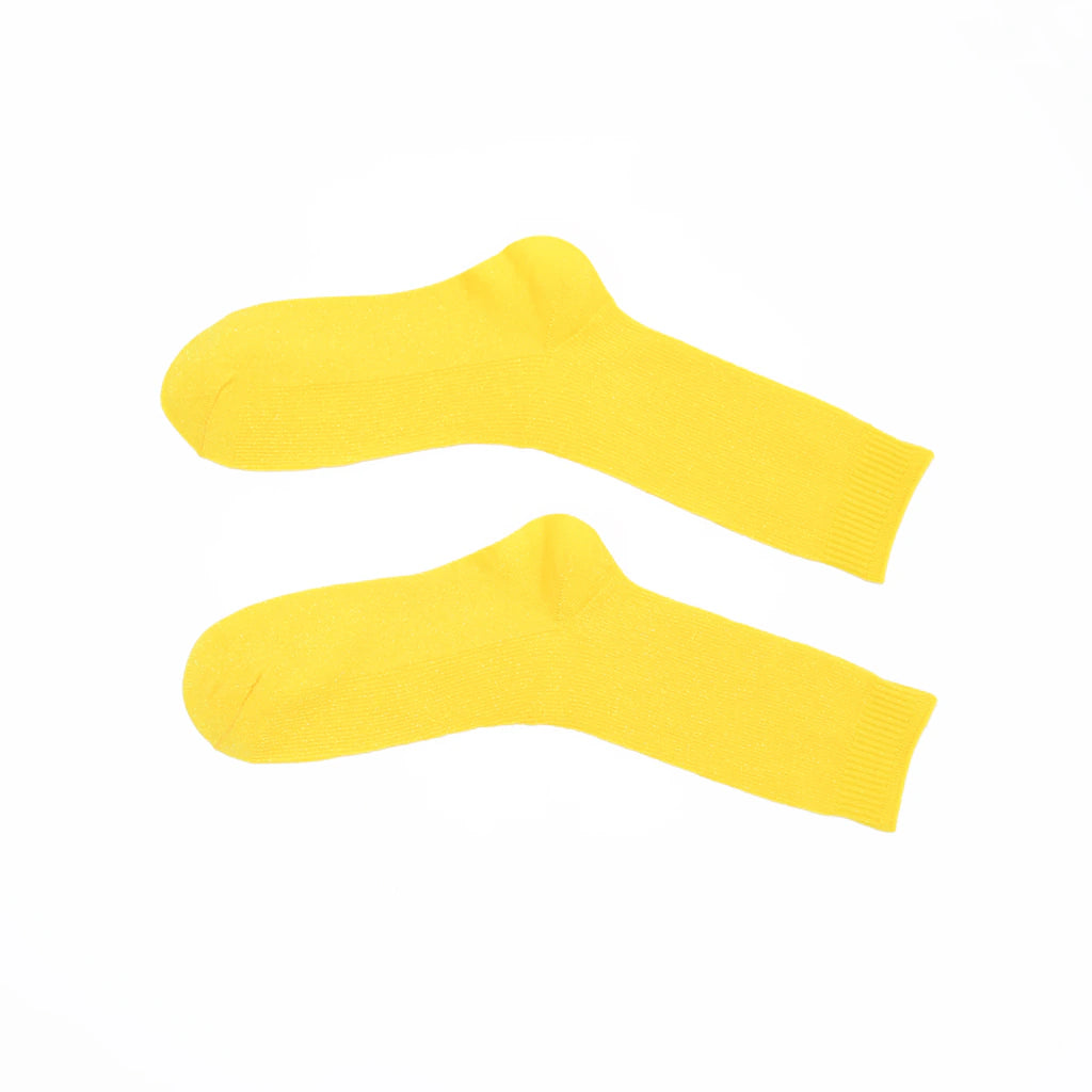 Two yellow socks on a white background