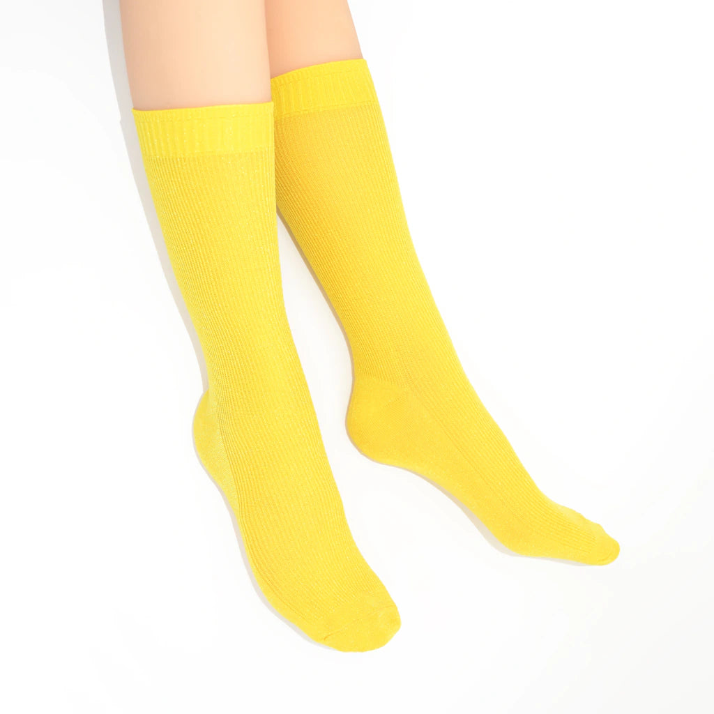 Yellow crew socks on a white background
