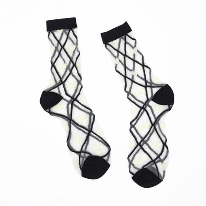 a pair of sheer base mesh socks with black contrast toe heel and cuffs with white hearts and black criss cross pattern