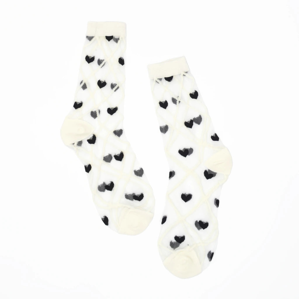 a pair of sheer mesh socks with black heart and white criss cross pattern