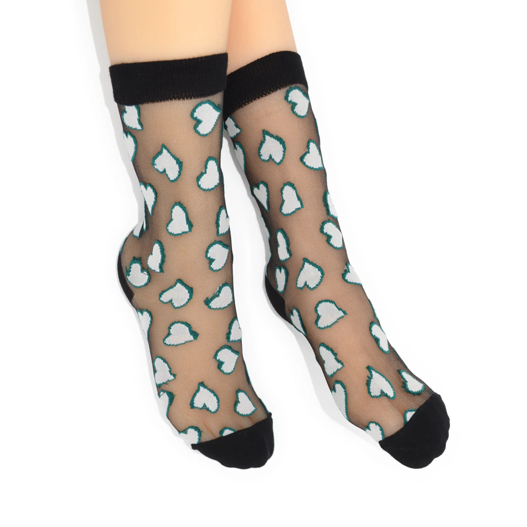 Sheer socks with heart pattern and black toes and cuffs on a white background