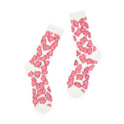 White socks with pink heart patterns on a white background