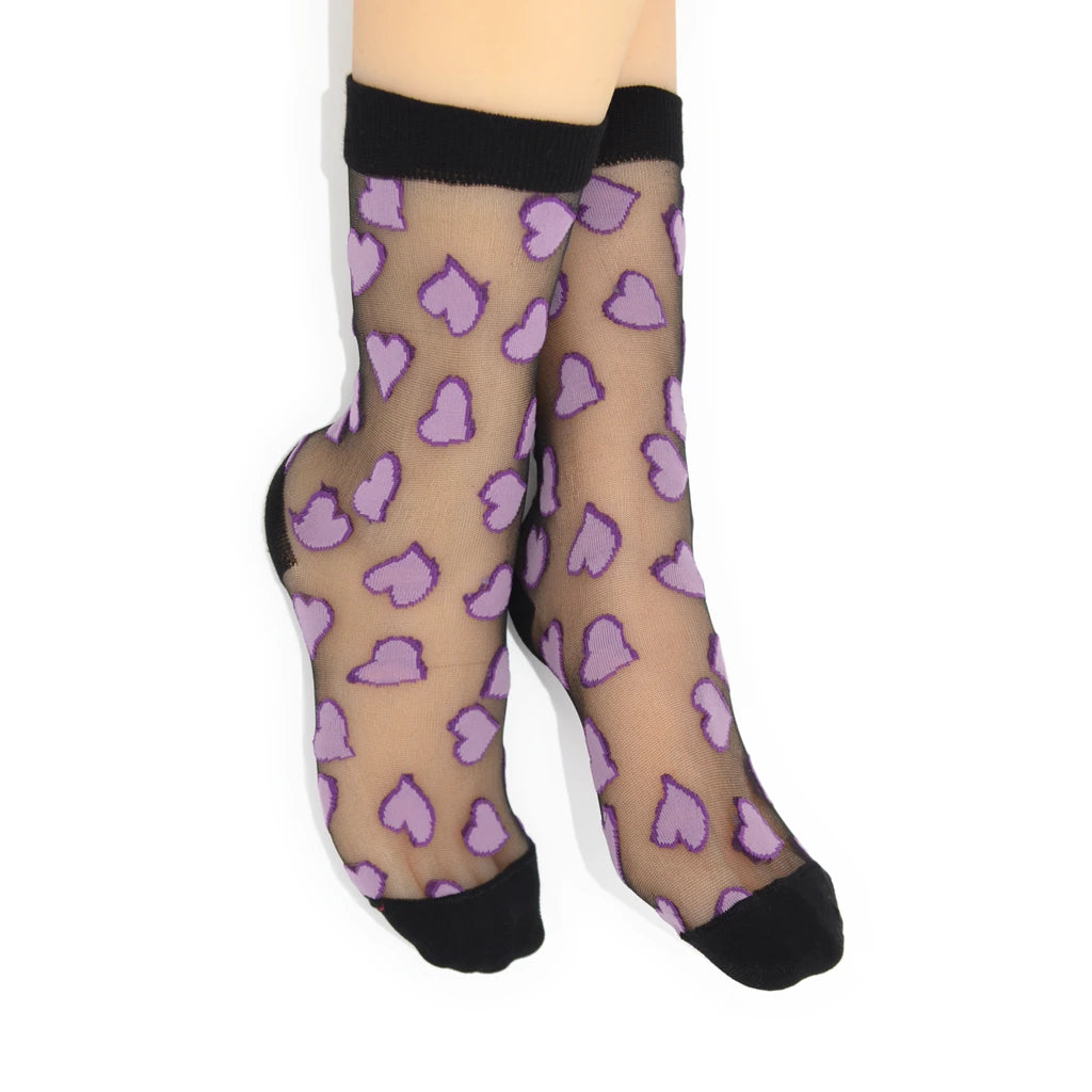 Sheer socks with purple heart pattern and black toes and cuffs on a white background