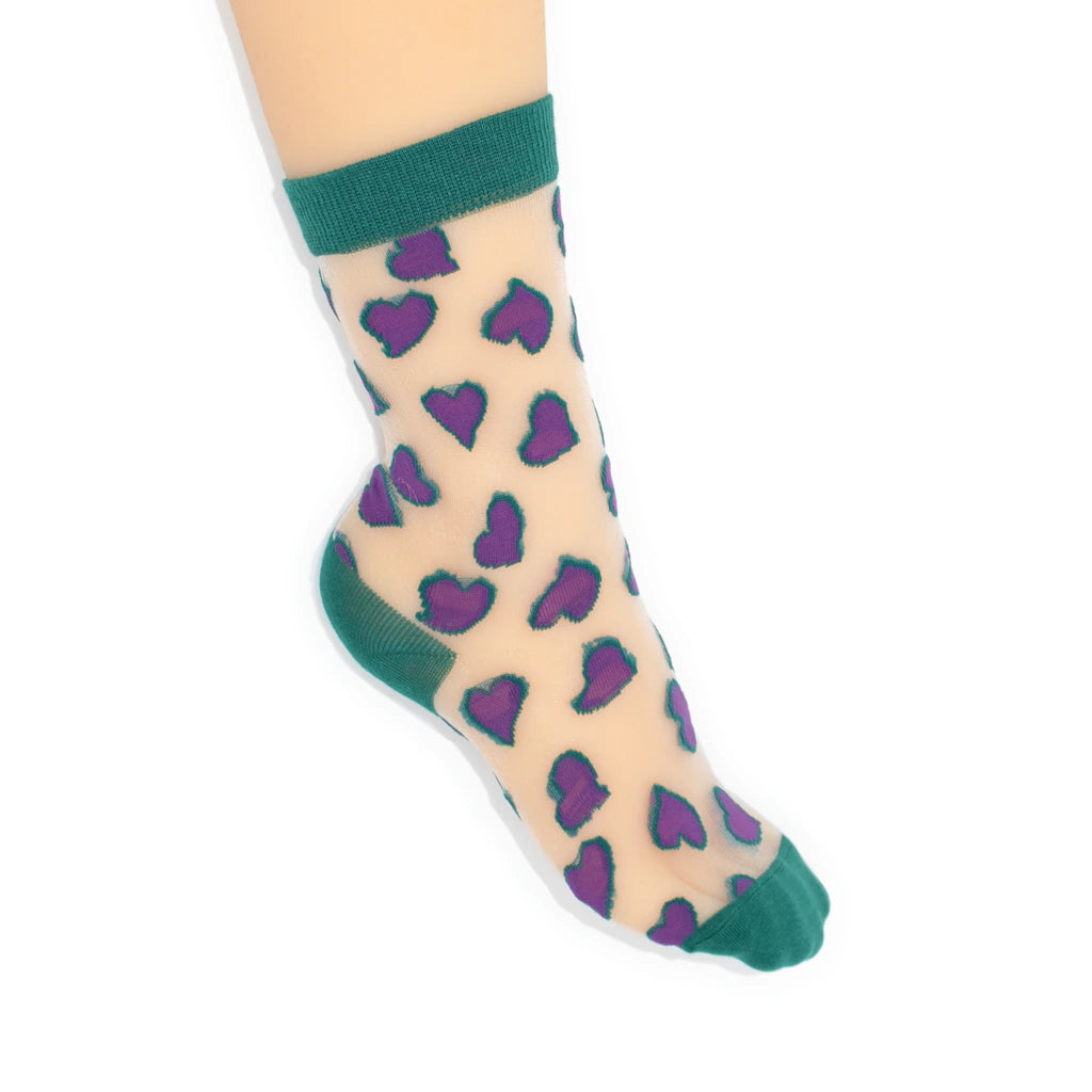 Sheer socks with purple heart pattern and green accents on a white background