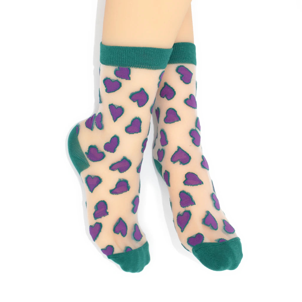 Sheer socks with purple heart pattern and green cuffs and toes on a white background