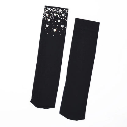 Black socks with heart crystals on a white background