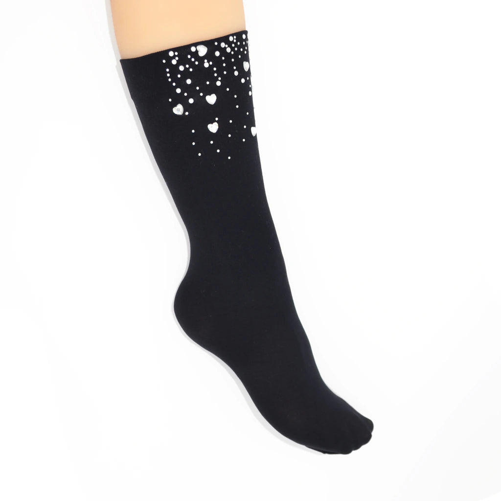 Black knee-high sock with crystal heart gems on a white background
