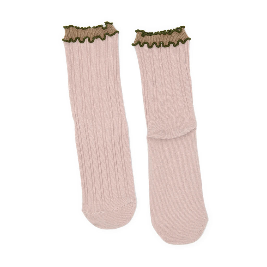 Pair of light pink socks with green ribbed cuffs on a white background