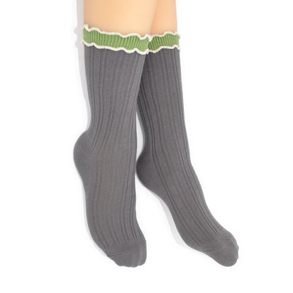 Gray CREW socks with green trim on a white background
