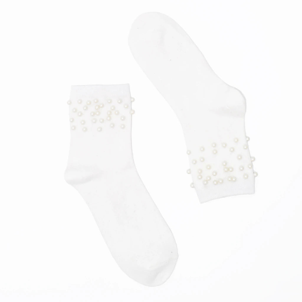 White ankle socks with pearl embellishments on a white background