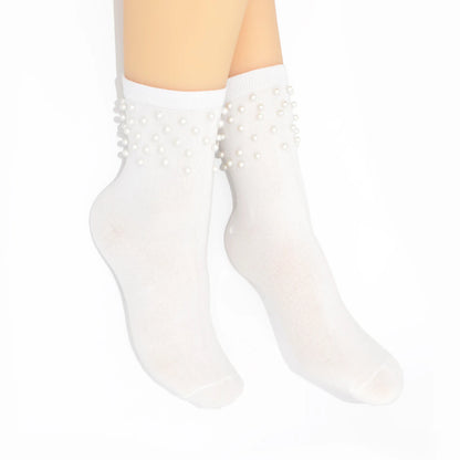 White sheer socks with pearl embellishments on a white background