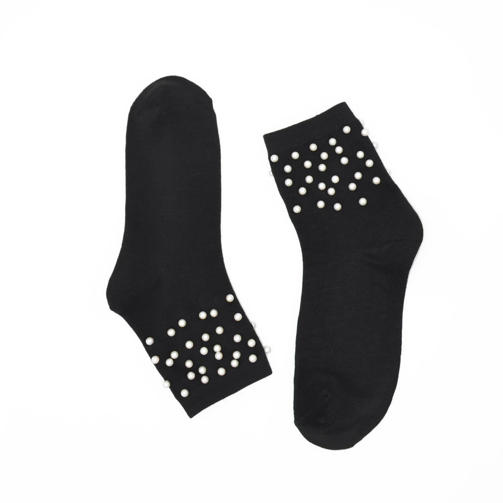 Black socks with white pearls on a white background