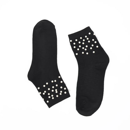 Black socks with white pearls on a white background