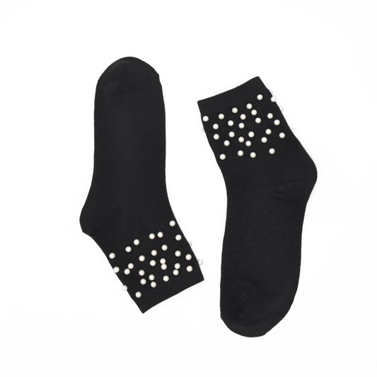 Black socks with white pearls on a white background