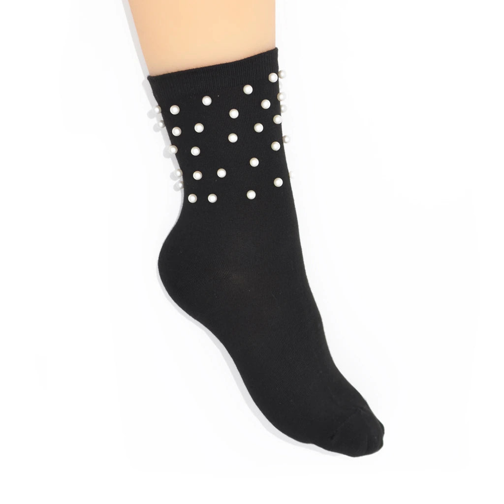 Black sock with white pearl embellishments on a white background