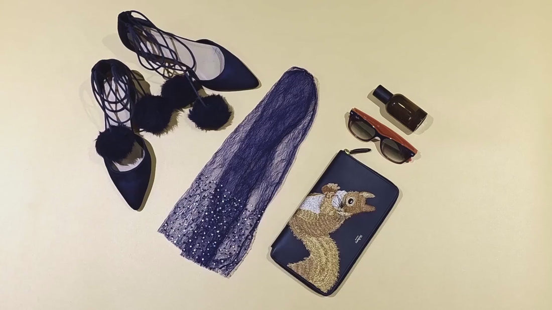 hand grabbing various sock styles from stylish flat lays