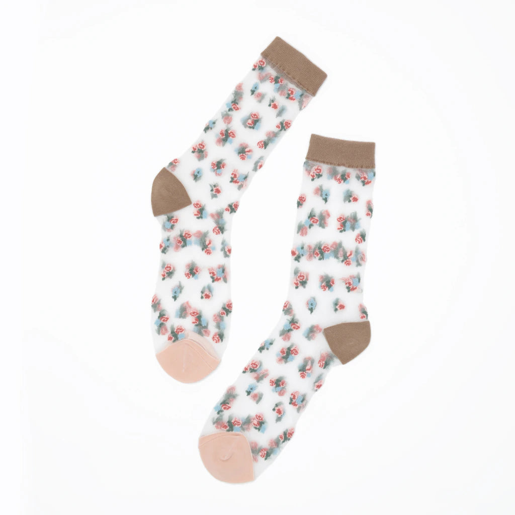 A pair of white crew socks with a small pink and blue floral pattern, featuring solid brown cuffs, heels, and toes, displayed on a clean white background.